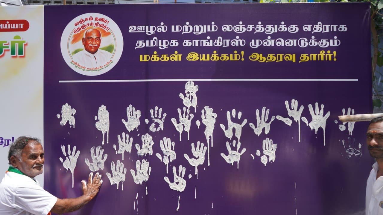 People pledging with handprints